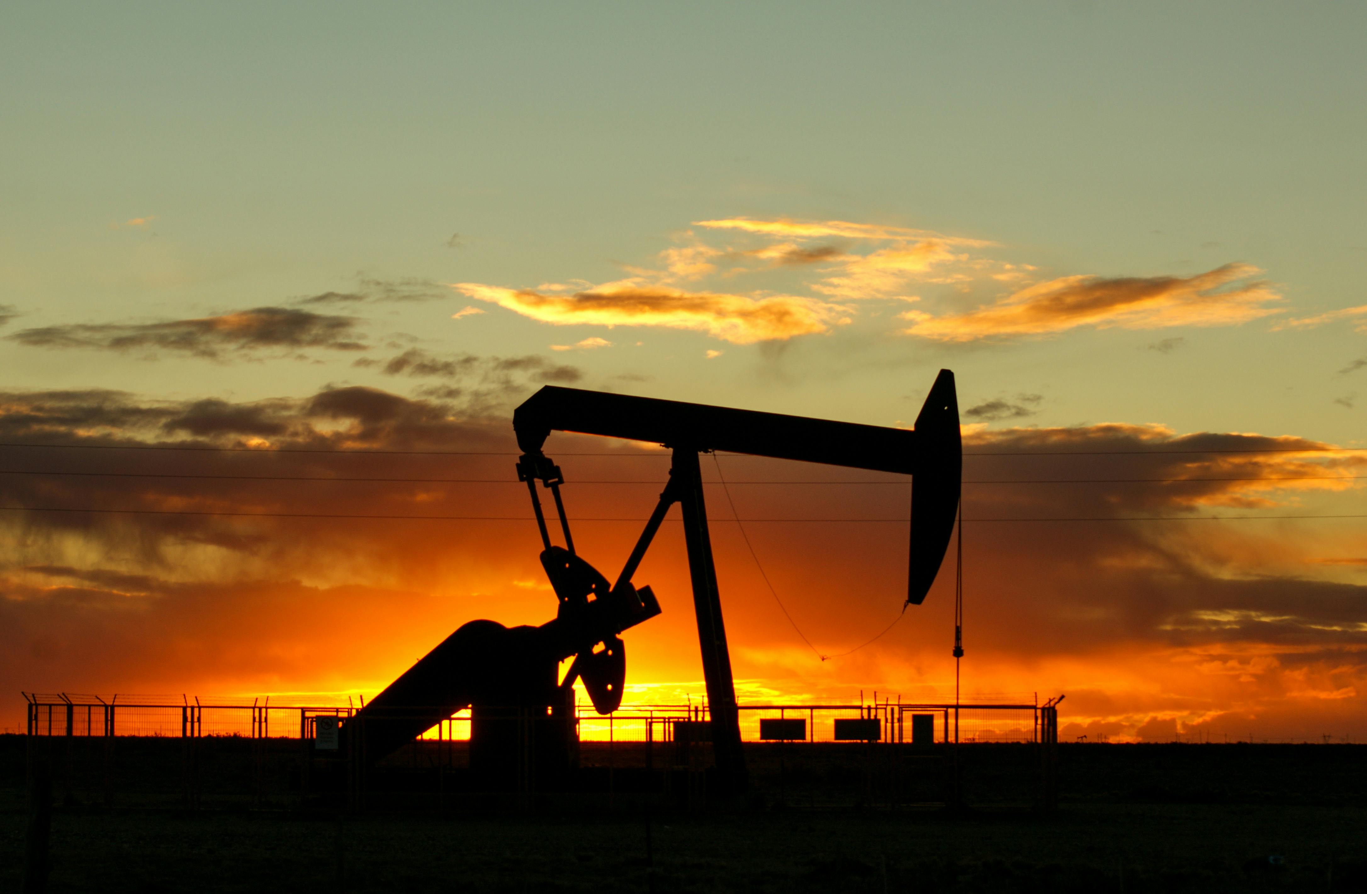 Oil well at sunset